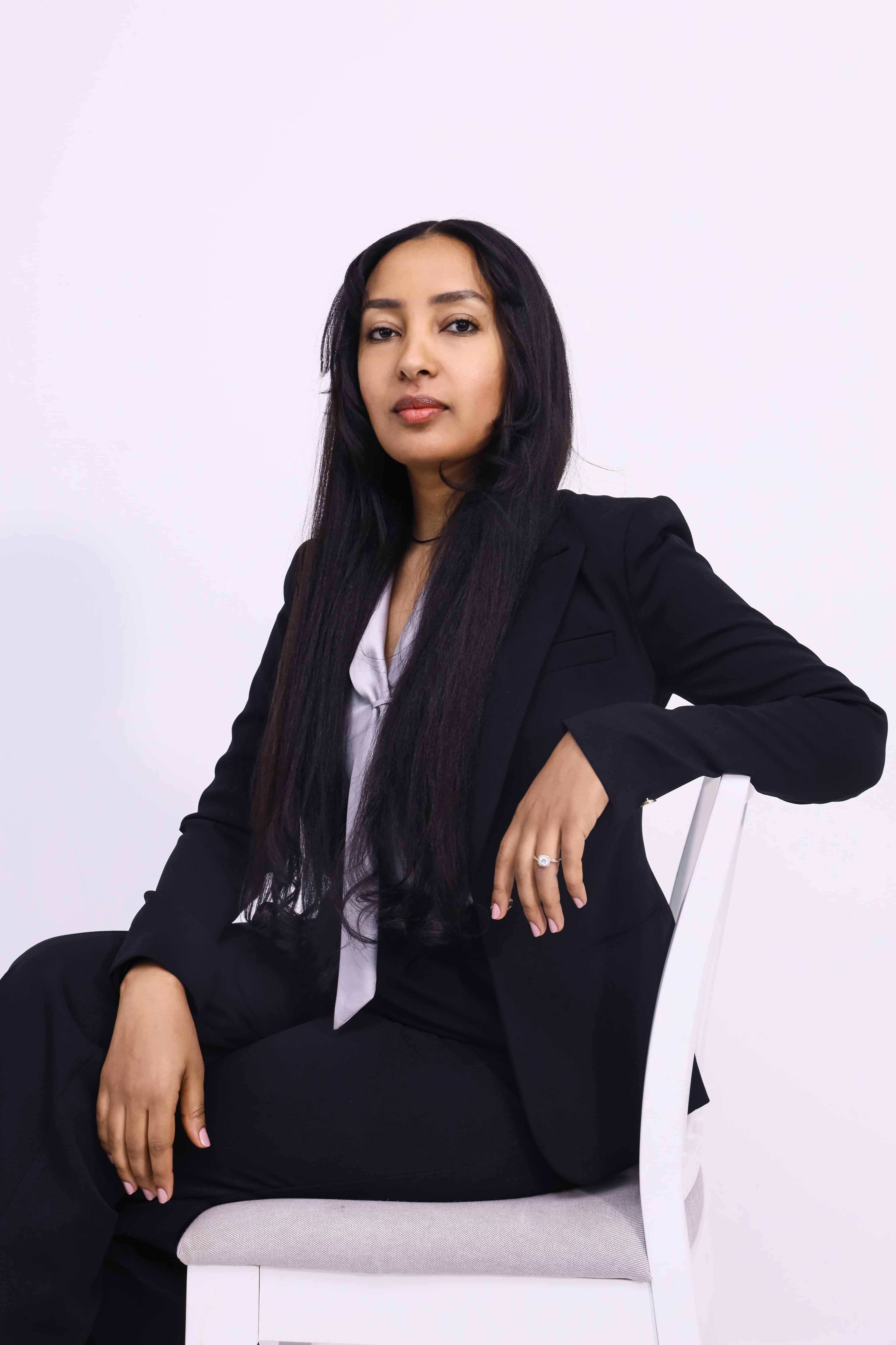 Corporate executive headshot with gray backdrop